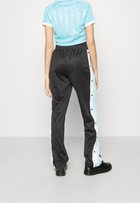 adidas Originals Träningsbyxor - black