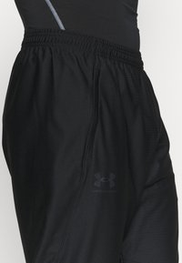 Under Armour Pantalones deportivos - black