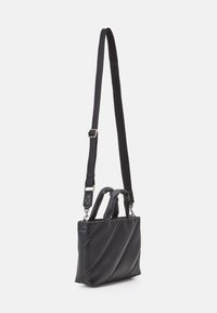 Black leather handbag with a structured shape, featuring diagonal quilted design, dual top handles, and an adjustable strap.