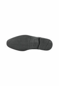 Suela de zapato de goma negra con patrón de agarre texturizado y bordes suaves. Presenta el logo de la marca en el costado y surcos de flexión notables.