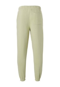 Jasnozielone spodnie dresowe z elastycznym pasem i mankietami, wyposażone w jedną naszywaną kieszeń z tyłu po prawej stronie.
