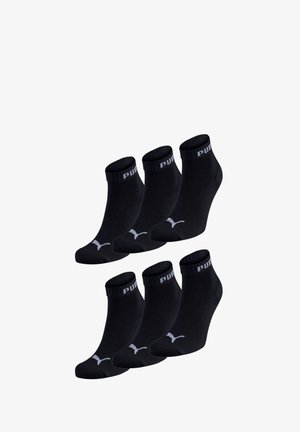 Black ankle socks made of cotton blend, featuring ribbed cuffs, a logo on the band, and a low-cut design. Pack of six pairs.