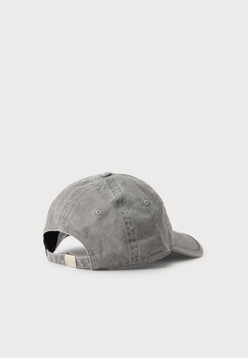 Gray washed cotton baseball cap shown from the back with adjustable strap and metal buckle on a plain white background.