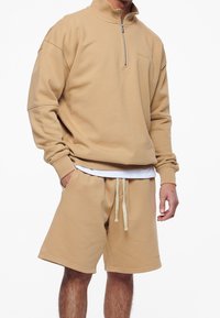 Pegador Felpa - cognac