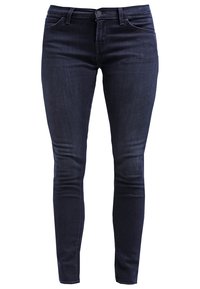 Mörk denim skinny jeans med mid-waist, bälteshållare, framfickor och enstaka knappstängning. Slät textur och figurnära design.