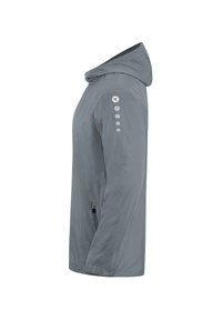 Veste à capuche grise claire en tissu lisse et résistant à l'eau, dotée d'une fermeture éclair sur le devant, de poignets élastiques et d'un détail de logo sur la manche.