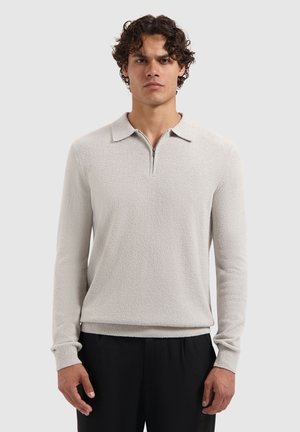 Light gray pullover sweater with a textured surface, collar, and zipper placket. Fitted design with ribbed cuffs and hem.
