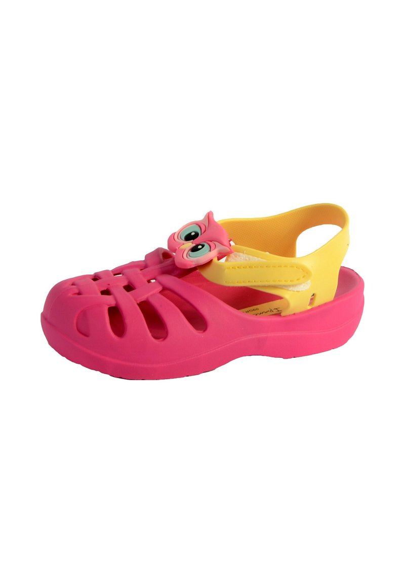 Pink plastic clogs with cut-out vents and a yellow back strap. Features an owl-shaped accent on the front, with large eyes and a playful design.