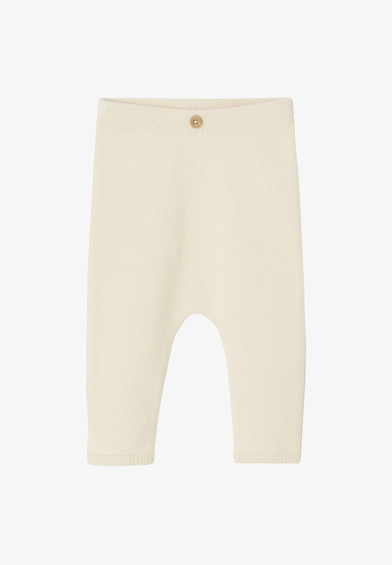 Cream-colored ribbed baby leggings with a fitted silhouette, featuring a small button closure at the waistband and soft, stretchy fabric.