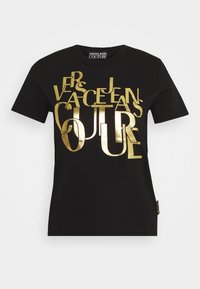 Black cotton t-shirt featuring raised, gold metallic text reading "Versace Jeans Couture." Short sleeves and a classic crew neckline.