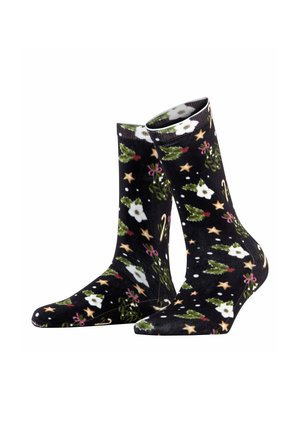 Calze nere con un motivo festivo che presenta fiori bianchi, foglie verdi, bastoncini di zucchero e stelle dorate su uno sfondo texturizzato.