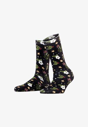 Calze nere con un motivo festivo che presenta fiori bianchi, foglie verdi, bastoncini di zucchero e stelle dorate su uno sfondo texturizzato.