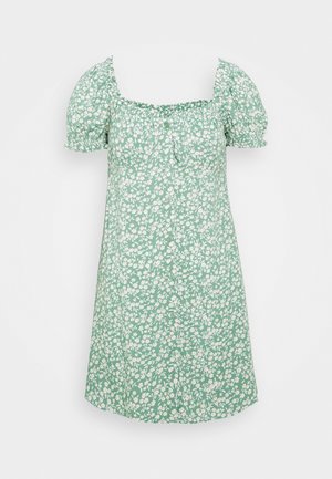 Robe courte verte à motif floral blanc, manches courtes bouffantes, encolure carrée, et boutons sur le devant.