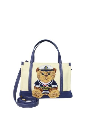 Borsa beige e blu navy con doppie maniglie e un orsetto con indosso un completo da marinaio ricamato sulla parte anteriore, con testo "Rue Madam Paris".