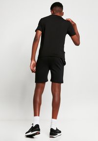 11 DEGREES Pantalones deportivos - black