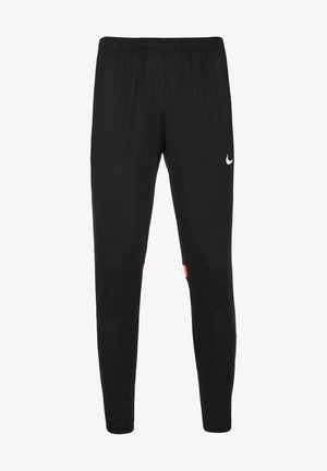 Pantalons de sport noirs en matériau synthétique avec une taille élastique. Présente un logo blanc et un accent rouge près du bas.