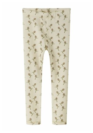 Leggings couleur crème avec un petit motif floral discret dans des tons roses et verts, avec une ceinture élastique.