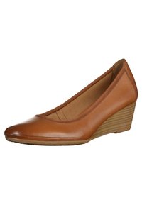 Chaussure compensée pour femme en cuir marron, bout fermé et petit talon empilé, finition lisse et design simple et élégant.
