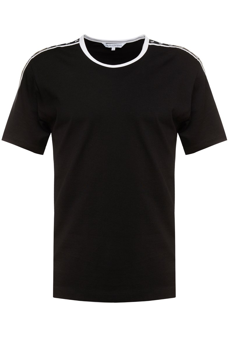 Musta puuvillapaita, jossa on pyöreä valkoinen kaula-aukko, lyhyet hihat ja kontrastiset valkoiset sivusuorat. Paita on normaalikokoinen ja siinä on sileä pinta.