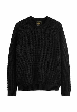 Sort strikket sweater med en tekstureret overflade, rund halsudskæring og ribbede manchetter og kant. Har raglanærmer og en løs pasform.