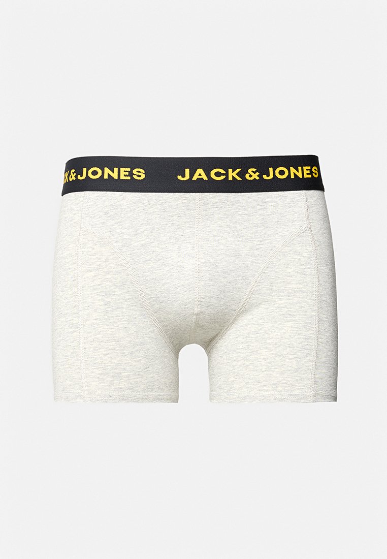 Boxer cortos de algodón gris con una cinturilla negra que presenta el texto amarillo "JACK & JONES". Diseño ajustado, detalles de costura mínimos.