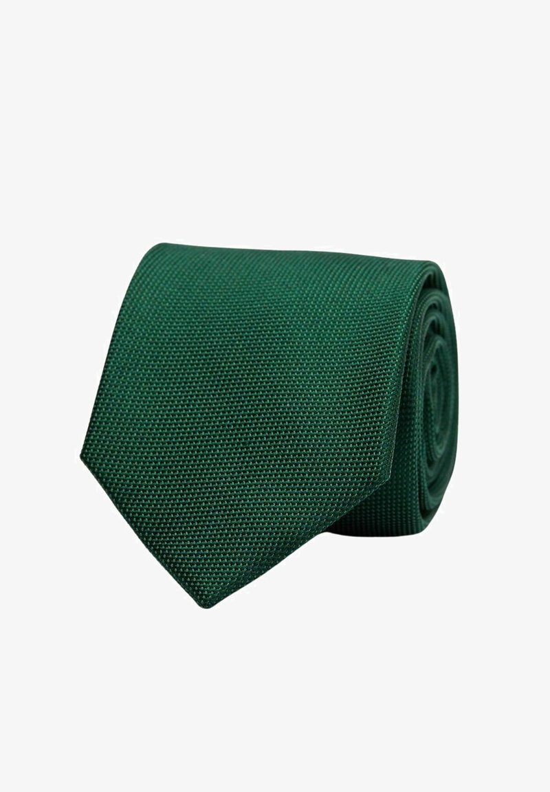 Grön texturerad slips rullad prydligt, som har en smal design med en spetsig ände. Materialet verkar vävt med ett subtilt mönster.