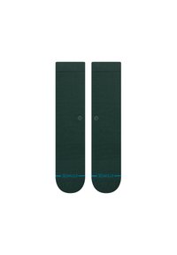 Chaussettes vert foncé jusqu'aux genoux avec une texture côtelée, présentant un logo bleu près des orteils et un bandeau solide en haut.