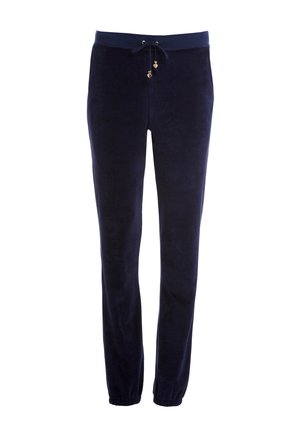 Pantaloni da jogger in velour blu navy con vita elasticizzata, cordoncino e hardware dorato. Gambe svasate con polsini elasticizzati alle caviglie.