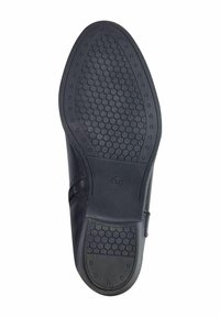 Semelle de chaussure noire avec un motif hexagonal. Présente une finition lisse, des zones de grip texturées et une étiquette de taille "37".