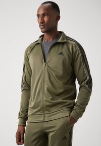 adidas Sportswear TRACKSUIT - Melegítő - olive strata