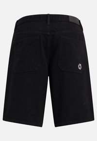 Black cotton shorts with a smooth texture, featuring two rear pockets and a hexagon logo patch on the right pocket.