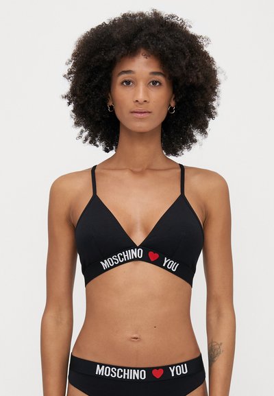 Black cotton triangle bralette with thin straps. Features "MOSCHINO LOVE YOU" in white and red on the band. Soft texture and minimal design.