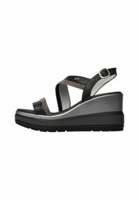 Black and silver wedge sandals feature a textured strap and ankle buckle, with a contoured platform and rubber sole for stability.