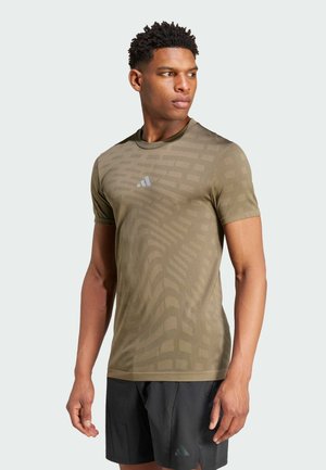 adidas Performance GYM SEAMLESS - T-shirt print - olive strata   shadow olive