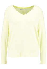 Jasnożółty sweter z długim rękawem i dekoltem w serek, o miękkiej fakturze i luźnym kroju. Charakterystyczny, kolorowy akcent na dekolcie, wykonany z dzianiny.