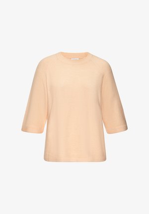 Hellpfirsichfarbener Strickpullover mit kurzen Ärmeln, Rundhalsausschnitt und lockerem Schnitt, präsentiert vor weißem Hintergrund.