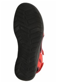 Suela roja de zapato con goma negra texturizada, que presenta un patrón de banda de rodadura en zigzag y una marcación de tamaño. Diseño limpio con el logotipo de la marca visible.