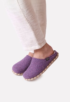 Purple felt slippers with a round toe, woven textured outsole, and a soft interior lining. Logo tag visible on the side.