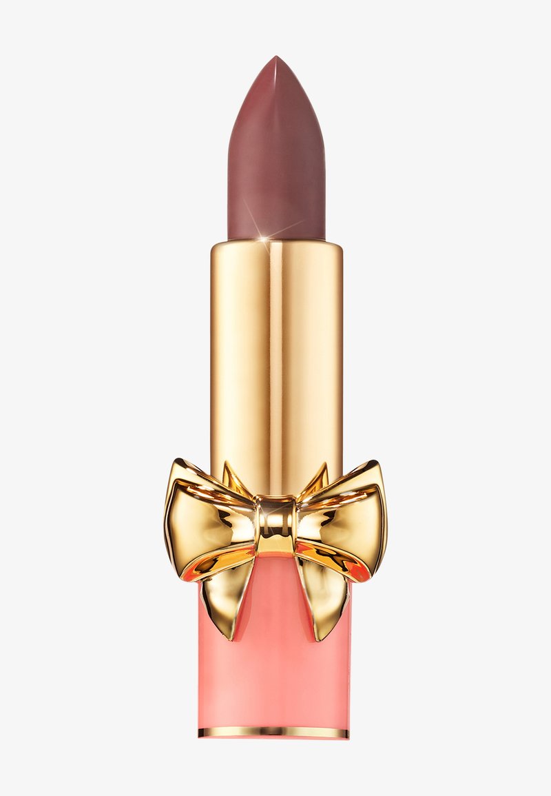 Lipstick with a pointed tip, pinkish-brown shade. Gold metallic casing with a pink-tinted bottom and a decorative gold bow accent.