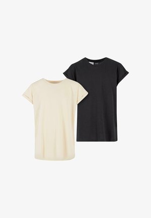 Két rövid ujjú póló: egy krém színű és egy fekete, puha pamutból készült, egyszerű, laza szabású és felgöngyölt ujjú.