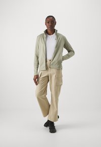 Peak Performance RIDER TECH ZIP JACKET - Sweater met rits - limit green
