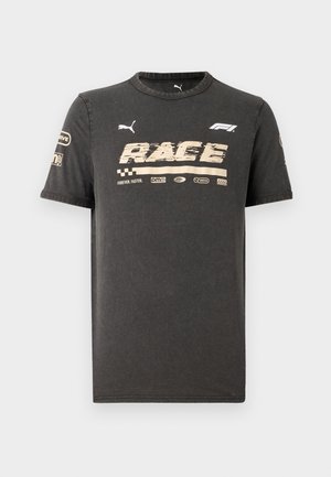 Black cotton t-shirt with short sleeves, featuring a graphic "RACE" in gold, distressed font and branding. Round neckline with smooth texture.