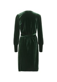 Robe longue en velours vert foncé avec ceinture ajustée à la taille et manches retroussées, vue de dos.