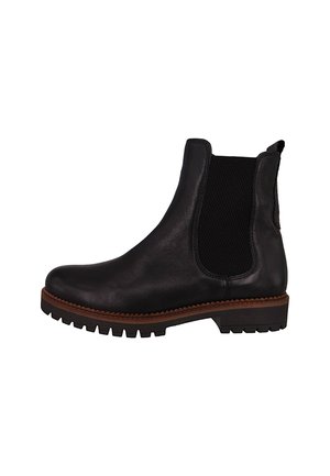 Black leather ankle boot with elastic side panels, textured fabric, round toe, and a treaded sole. Features contrasting brown rubber trim.