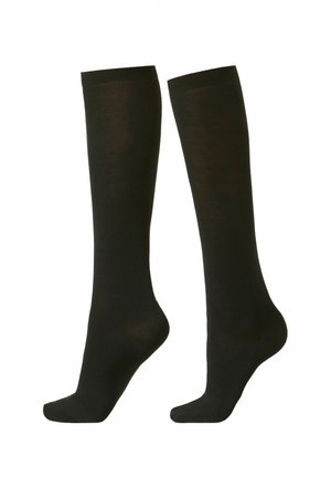 Medias negras hasta la rodilla hechas de un tejido suave, con puntera reforzada y un cómodo puño acanalado. Sin patrones ni acentos presentes.
