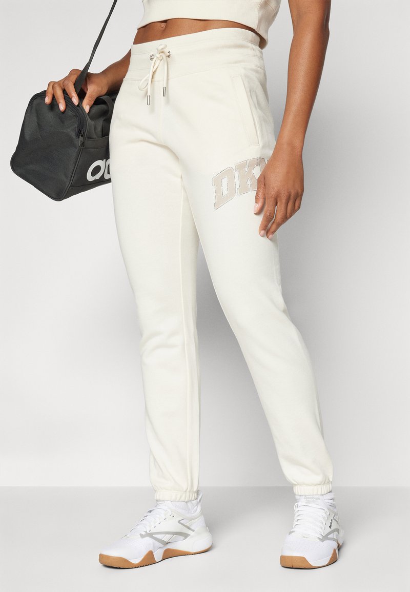 DKNY ARCHED DISTRESSED RHINESTONE LOGO RELAXED FIT JOGGER WITH