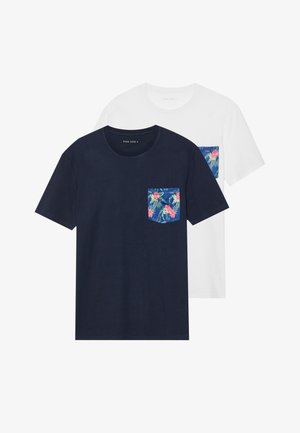 Two t-shirts in navy and white, both with a floral pocket design. Cotton material, short sleeves, crew neck. Pocket features vibrant colors.