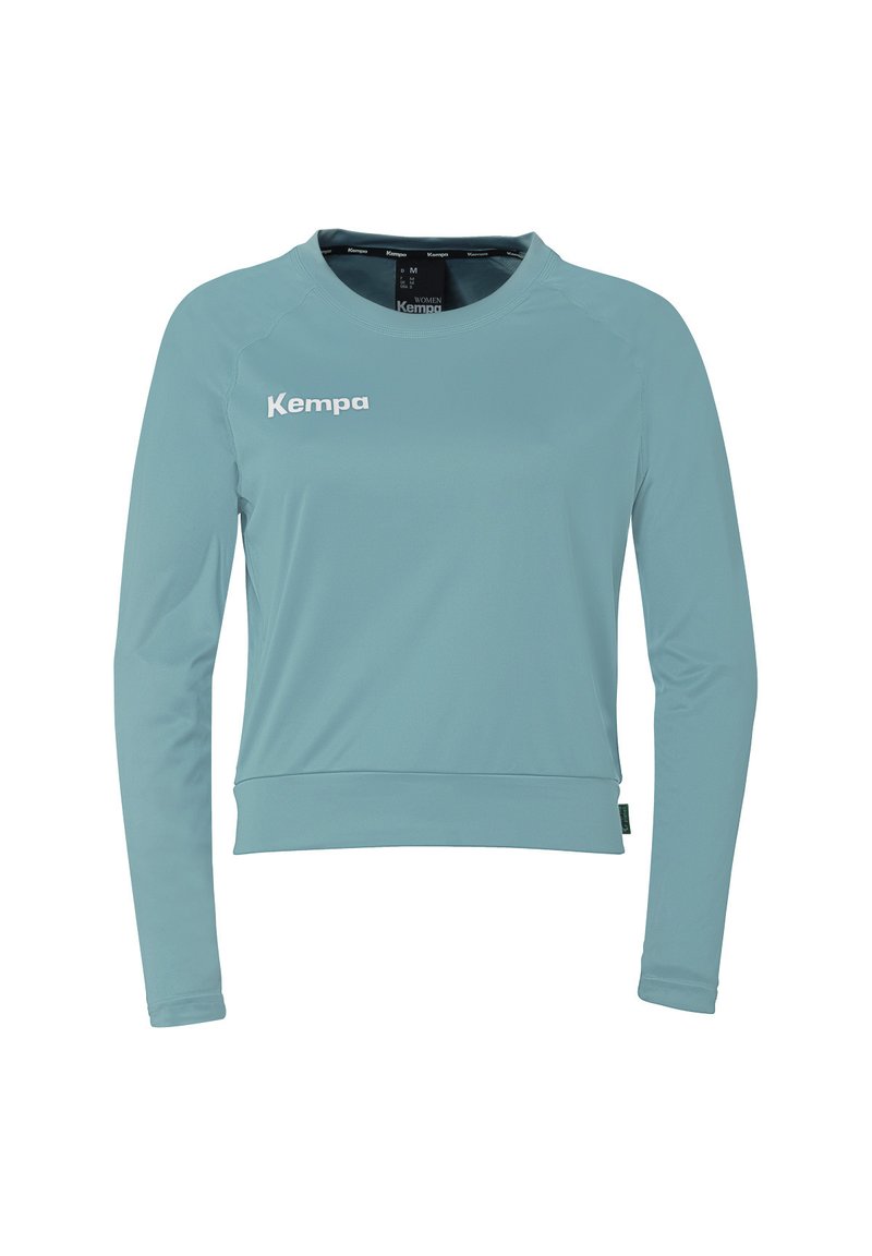 Lichtblauw longsleeve shirt van soepel stof, met een ronde halslijn en een wit "Kempa" logo op de borst.