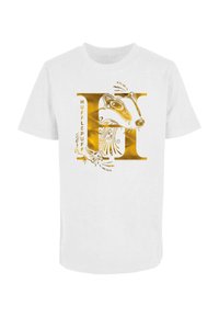 Balts T-krekls ar zelta Hufflepuff emblēmu, stilizētu lāci un vārdu "HUFFLEPUFF" treknās burtiem.