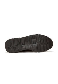 Black rubber shoe sole with deep, rectangular treads and textured grip patterns, shown from the bottom on a white background.